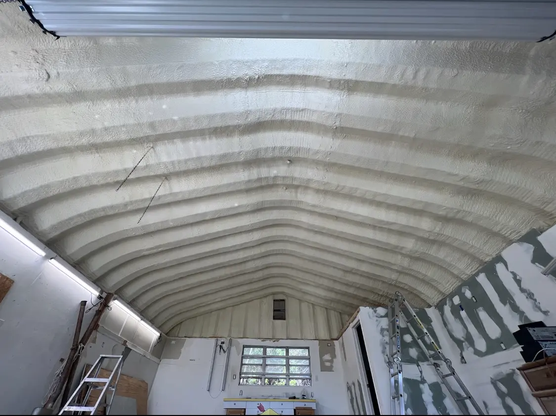 Spray polyurethane foam applied to the underside of a metal roof deck in Loveland